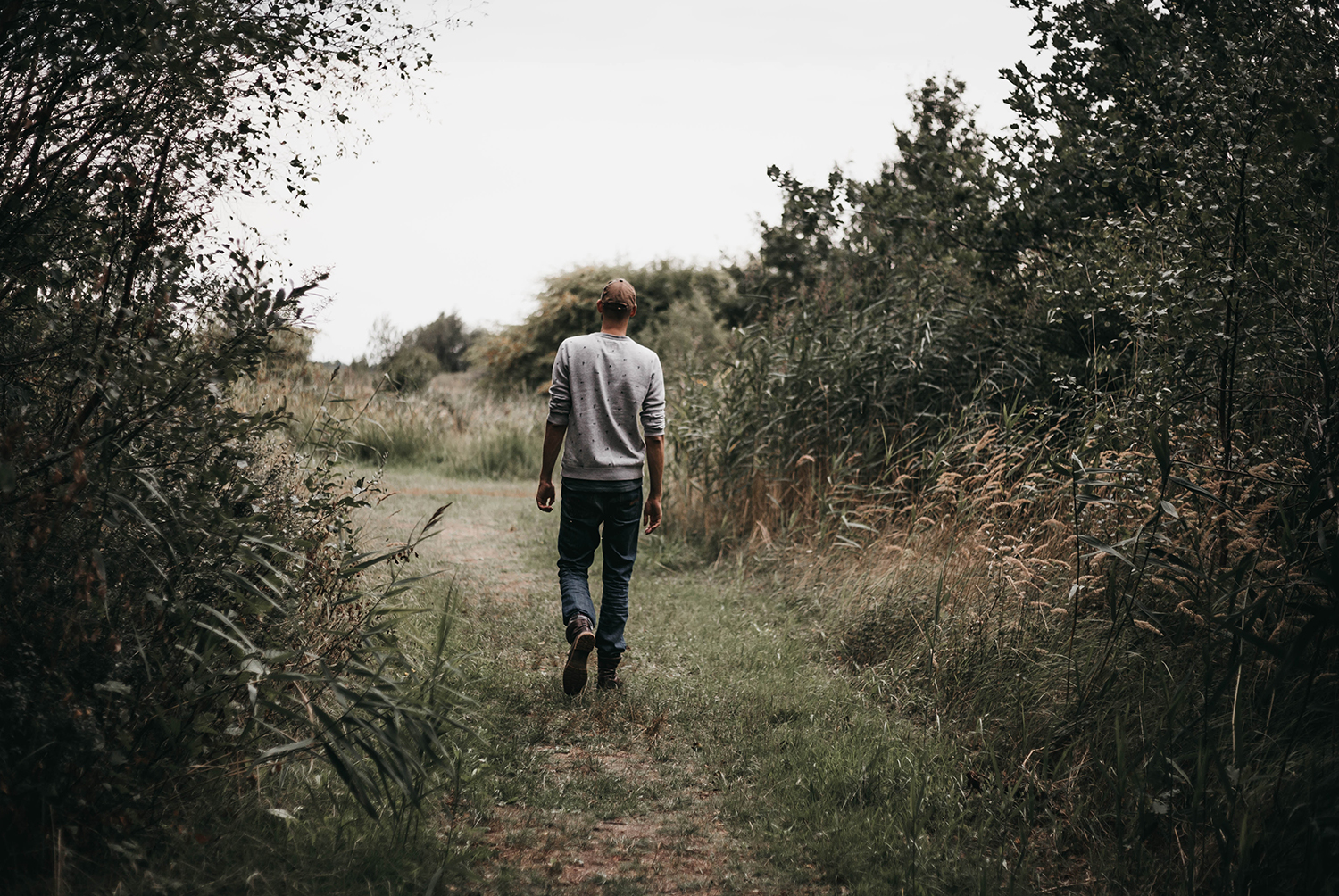 Man walking with his back to the camera