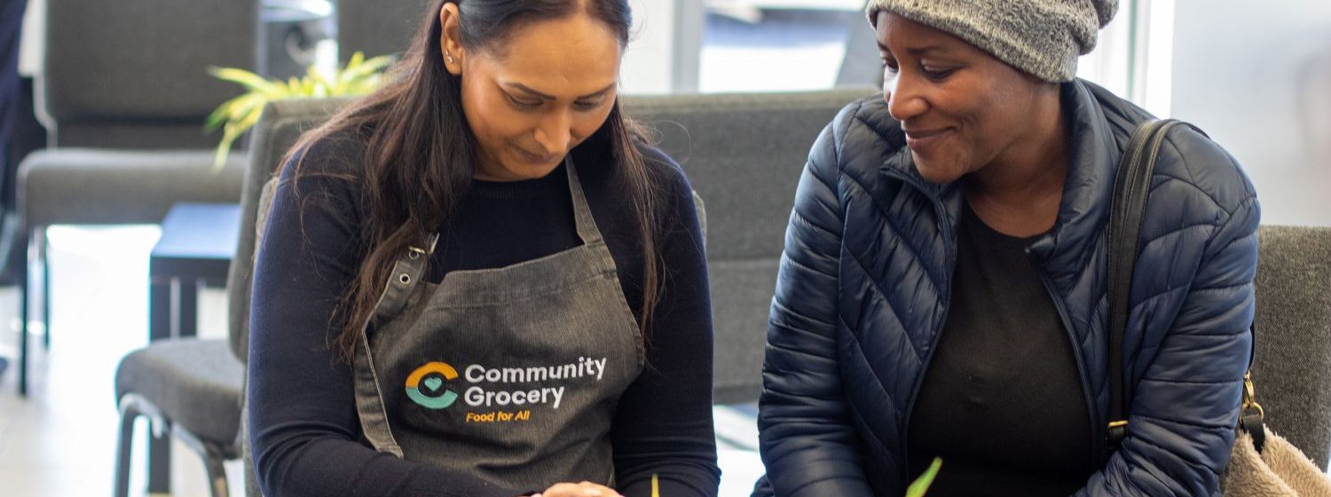 Community Grocery member chatting to the team