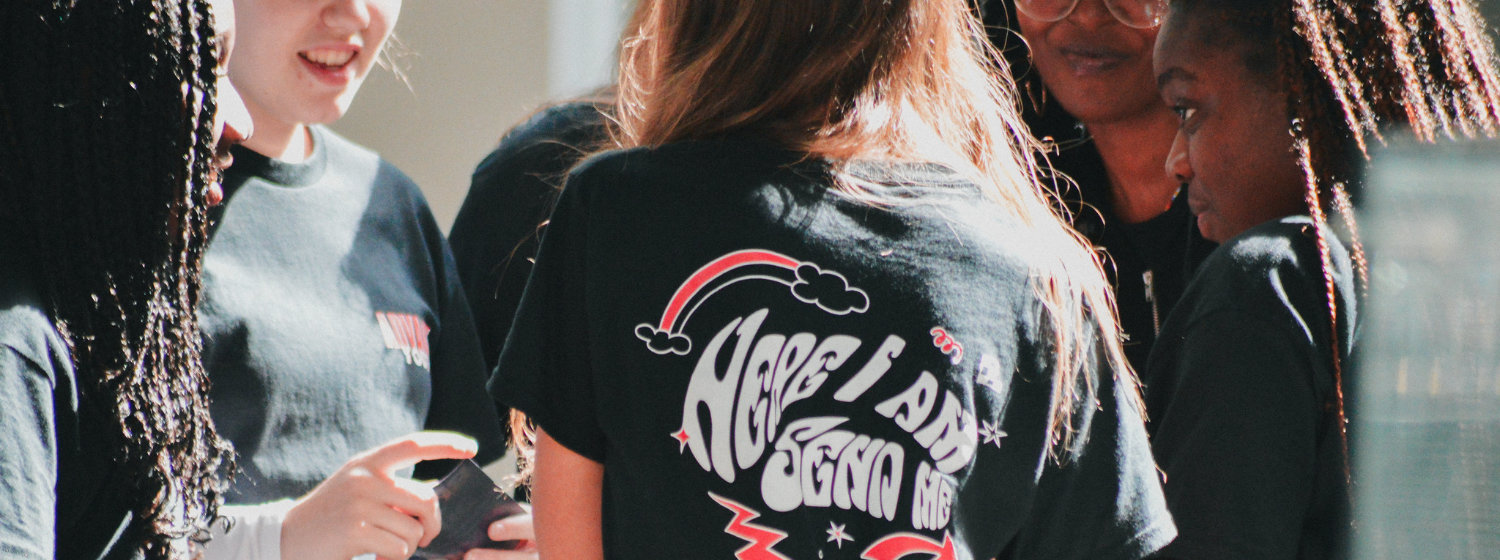 Young woman wearing a t-shirt that says "Here I am send me"