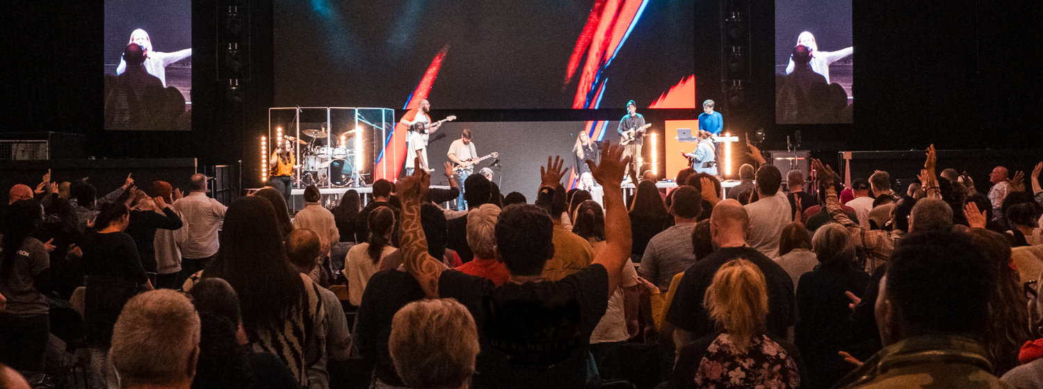 A crowd of people at a Message gig