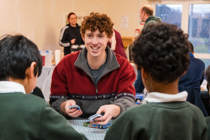Eden team leader Josh running a games cafe