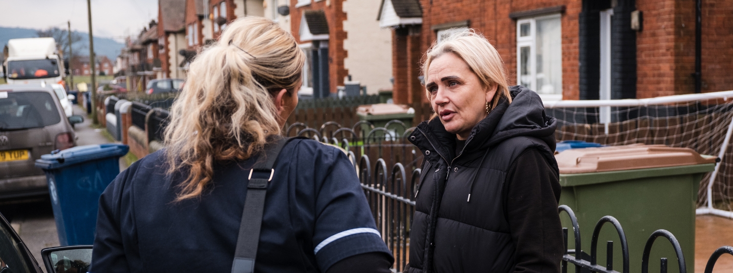 Kelly from Eden South Bank chatting to a neighbour on the street