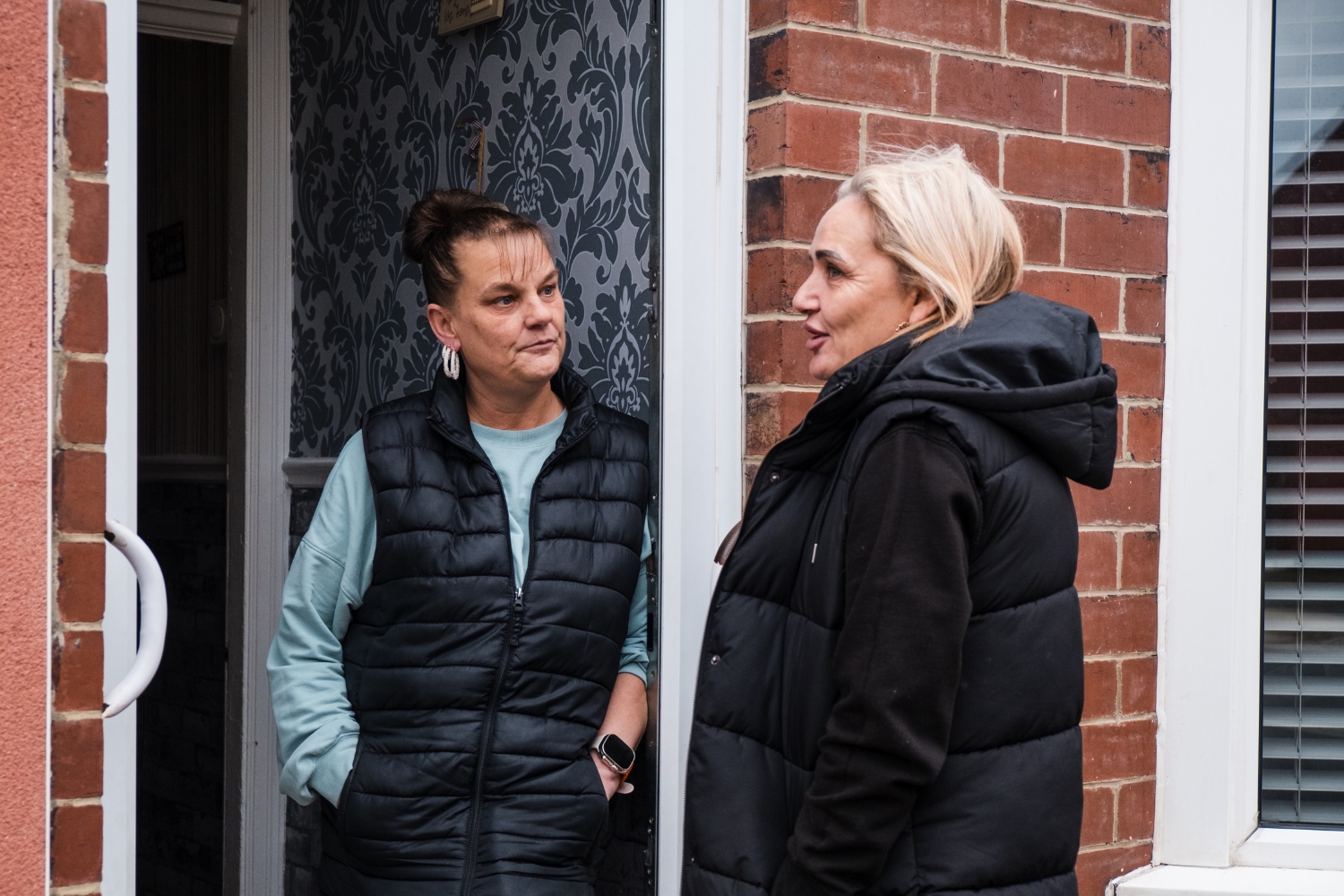 Kelly from Eden South Bank chatting to a neighbour on their doorstep