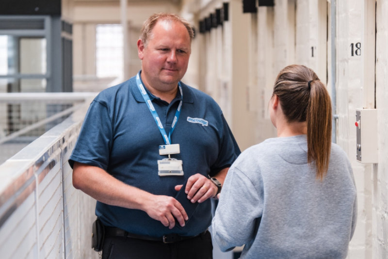 Message In Prisons worker talking to someone in prison