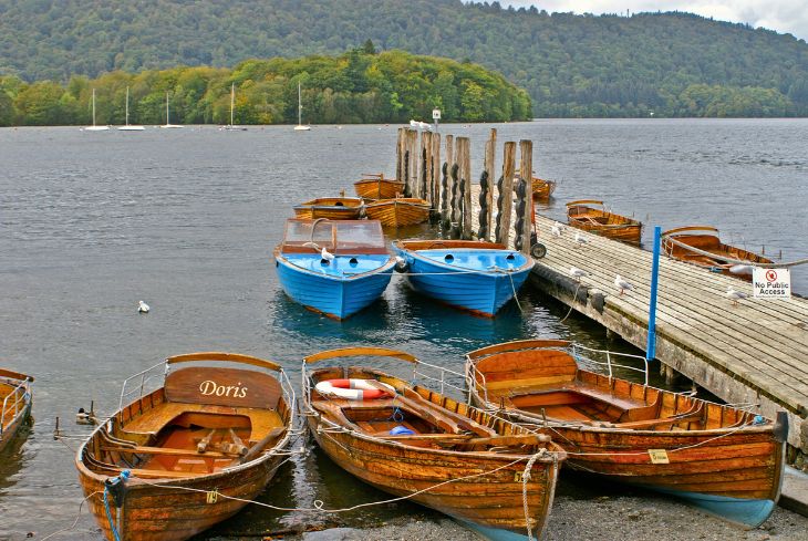 Rowing boats moored at a jetty on Lake Windermere.