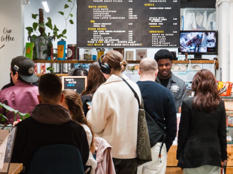 A queue of customers wait to be served at Neal Street Espresso.